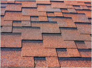 Close-up view of rust-colored asphalt shingles 