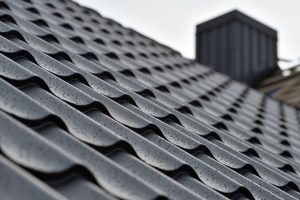Up close view of a grey metal roofing system.