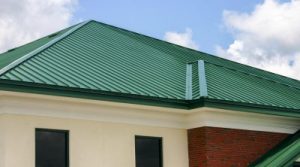 Bright green asphalt shingle roof installed on a commercial property.